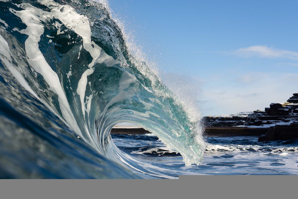 An ocean wave breaks