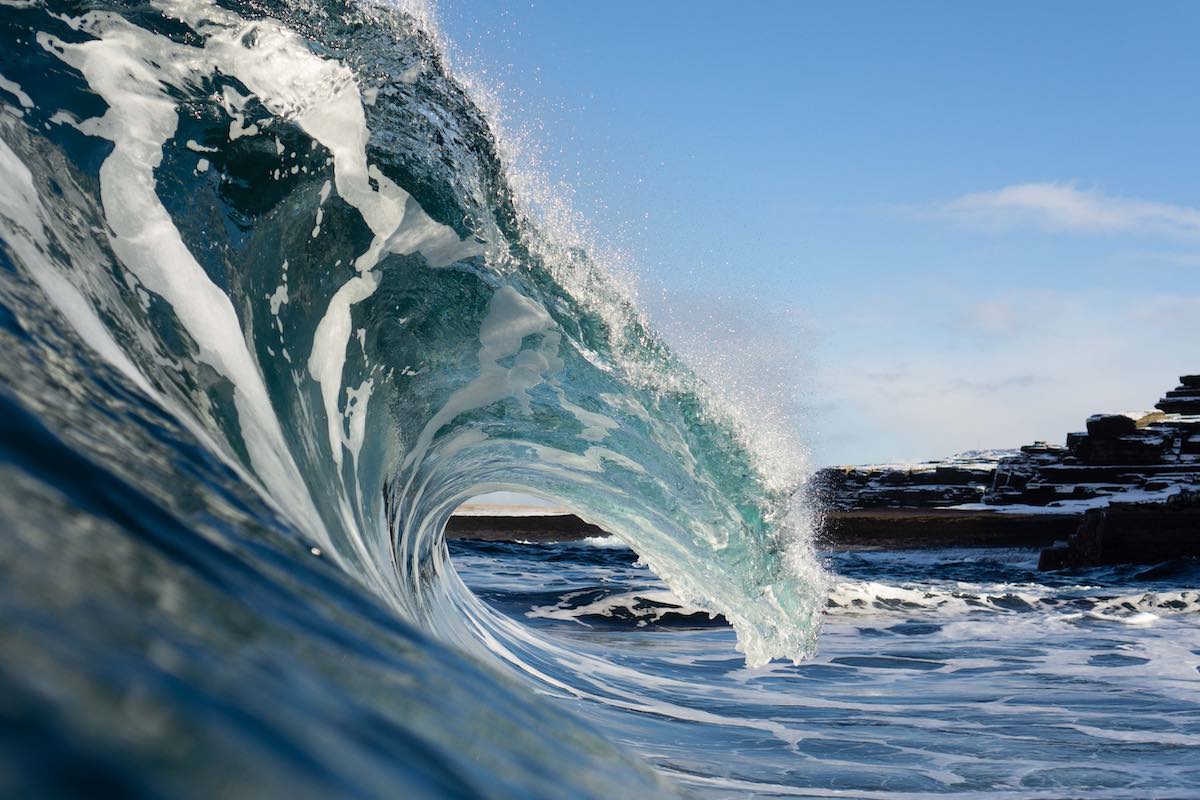 wave breaking with blue sky