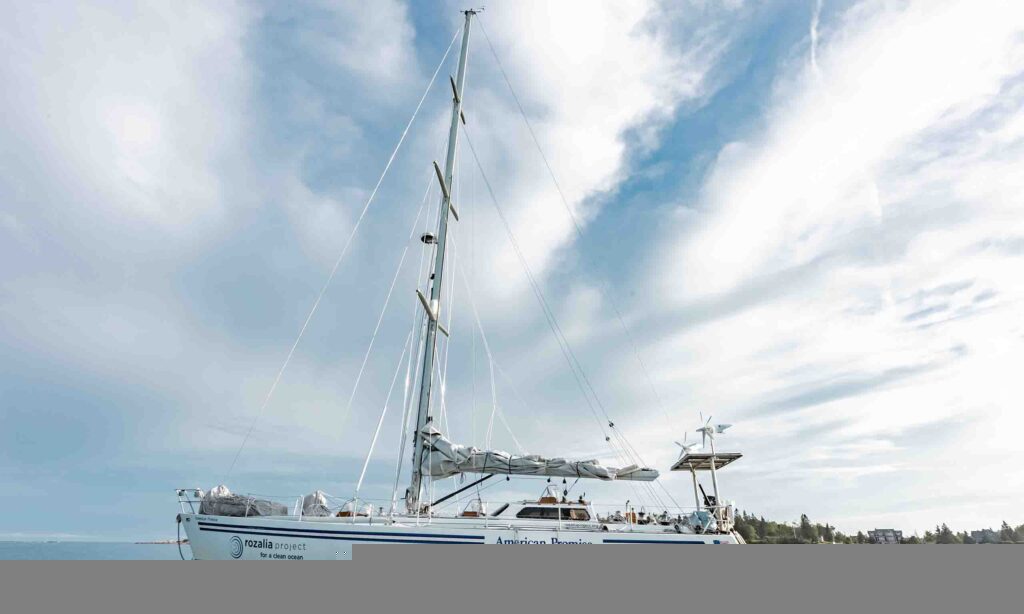 A sailboat named "The American Promise" sits on the water in the Gulf of Maine..