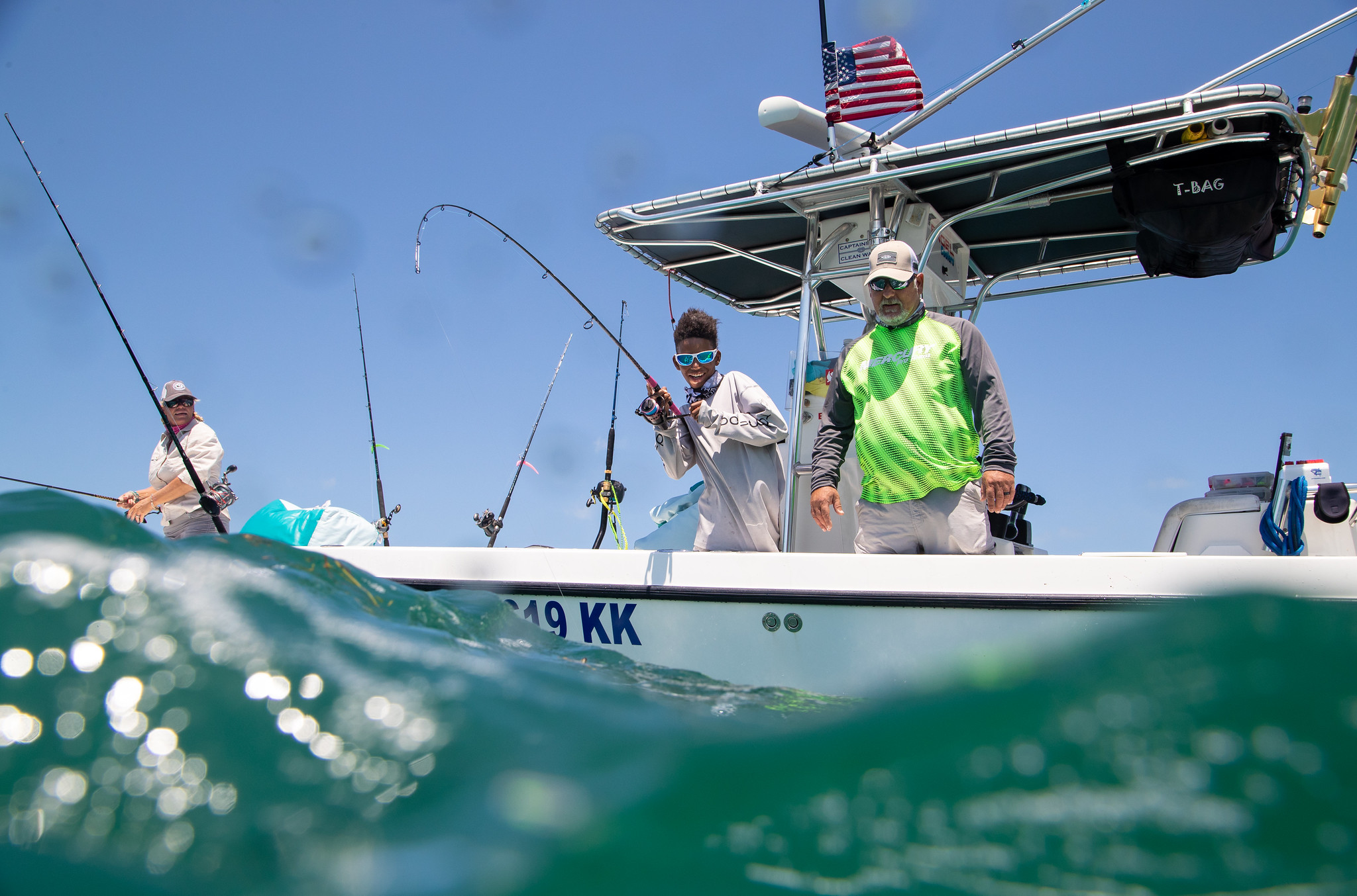 People fishing from a small ocean boat in Florida Keys National Marine Sanctuary